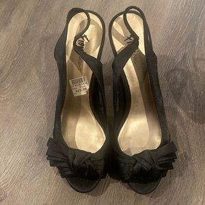 Black stiletto pumps.